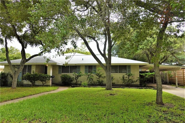128 Granby Pl, Portland, TX 78374 - single story home with a carport, concrete driveway, and brick siding