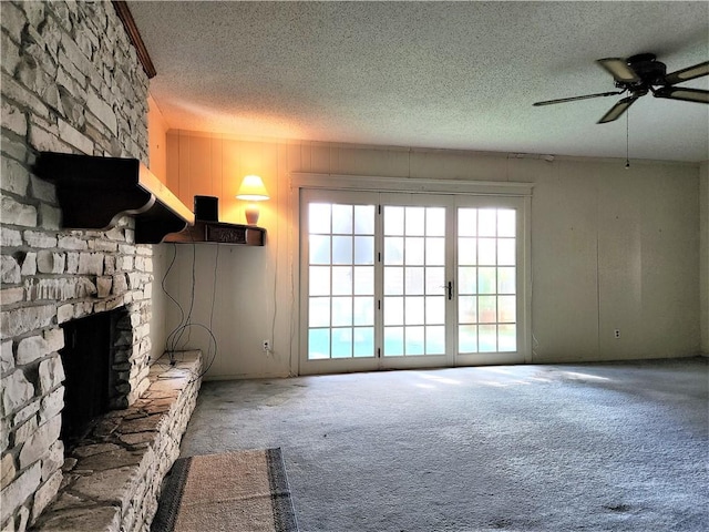 128 Granby Pl, Portland, TX 78374 - unfurnished living room with a textured ceiling, carpet flooring, a ceiling fan, and a fireplace