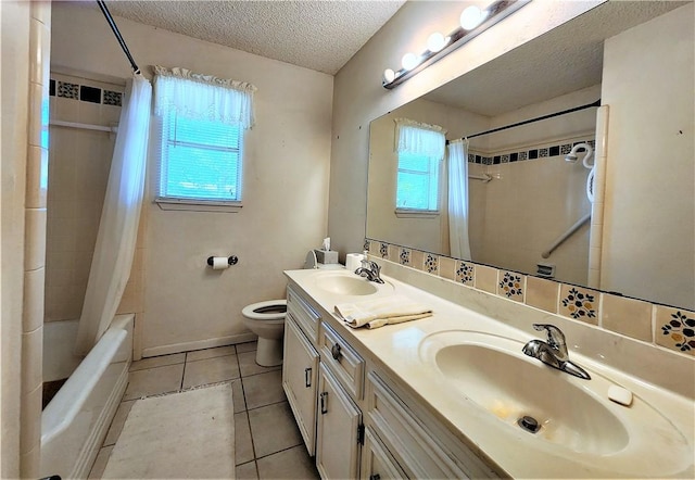 128 Granby Pl, Portland, TX 78374 - bathroom with plenty of natural light, a textured ceiling, toilet, tile patterned floors, and shower / tub combo with curtain