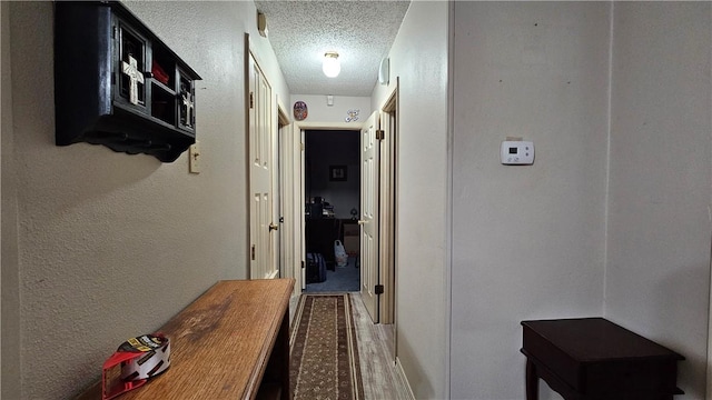 10200 Shane Dr, Corpus Christi, TX 78410 - corridor featuring a textured ceiling and wood finished floors