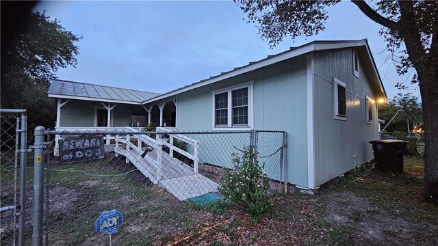 10200 Shane Dr, Corpus Christi, TX 78410 - back of house featuring a metal roof