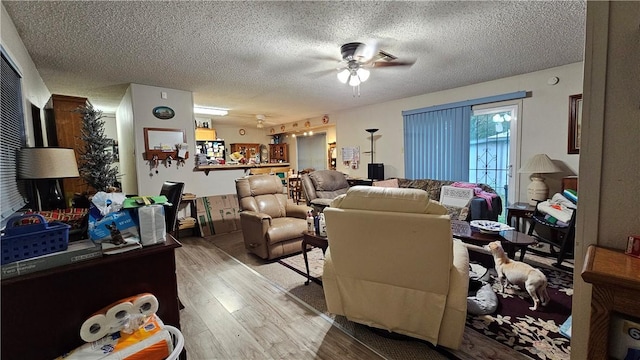 10200 Shane Dr, Corpus Christi, TX 78410 - living room featuring wood finished floors, a ceiling fan, and a textured ceiling
