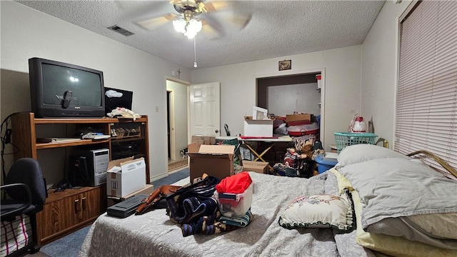 10200 Shane Dr, Corpus Christi, TX 78410 - carpeted bedroom featuring a textured ceiling, an office area, and a ceiling fan