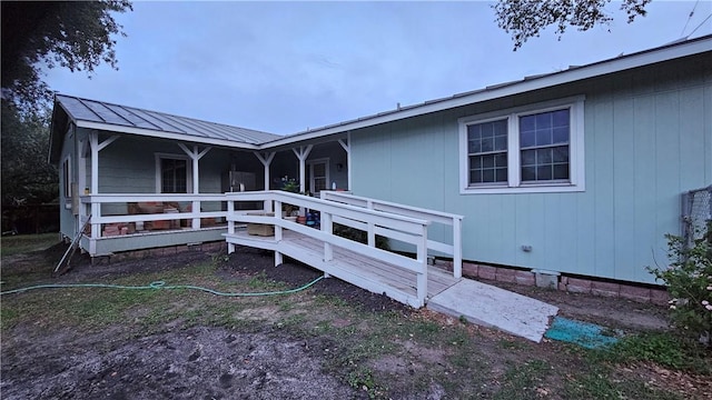 10200 Shane Dr, Corpus Christi, TX 78410 - rear view of house featuring a metal roof and a deck