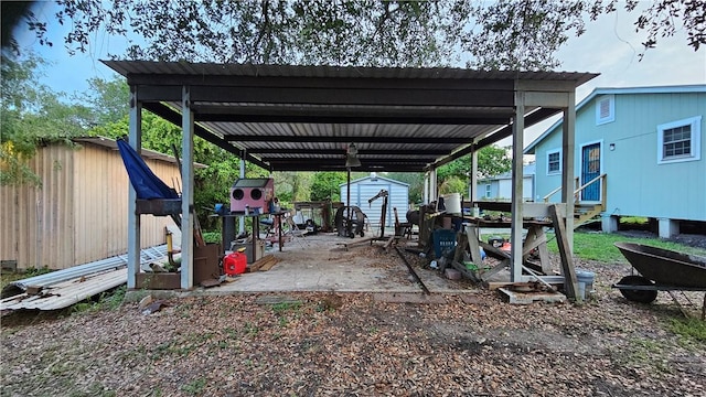 10200 Shane Dr, Corpus Christi, TX 78410 - view of car parking with a shed, entry steps, and a detached carport