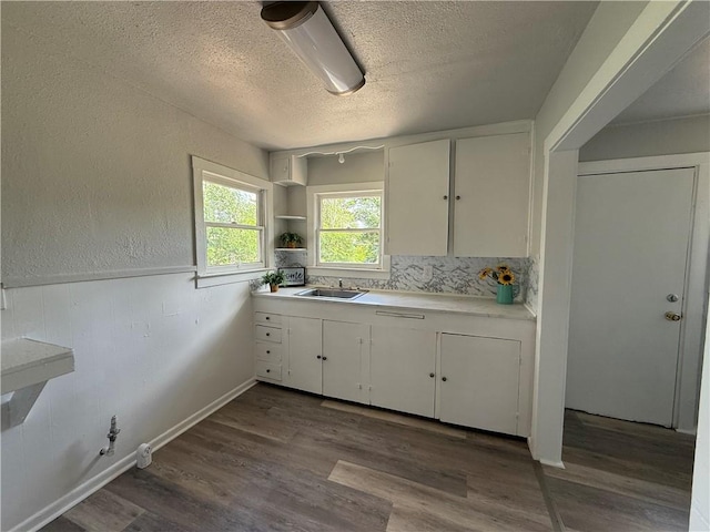 624 E Kenedy Ave, Kingsville, TX 78363 - kitchen with white cabinets, light countertops, a textured ceiling, dark wood finished floors, and open shelves