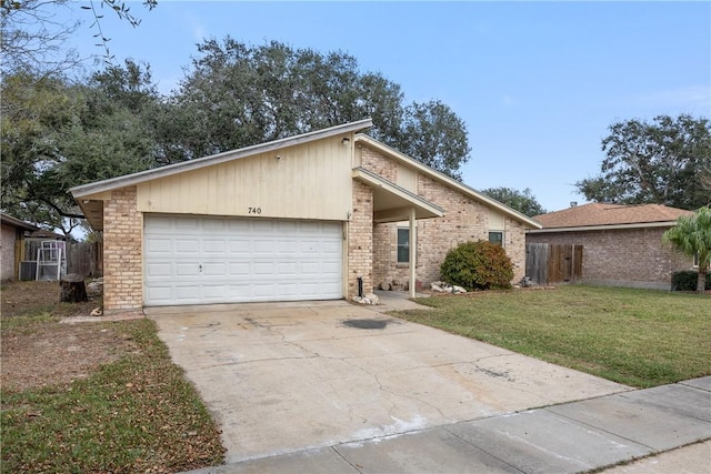 mid-century modern home with driveway, a garage, fence, a front yard, and brick siding