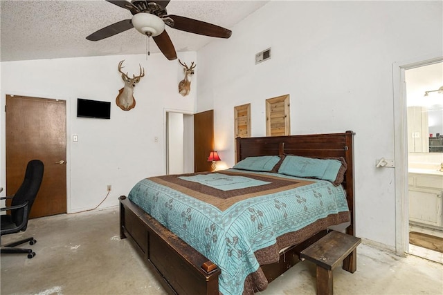 bedroom with ceiling fan, high vaulted ceiling, connected bathroom, and a textured ceiling