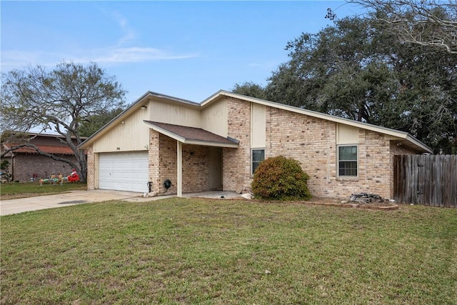 view of front of property with a front yard and a garage