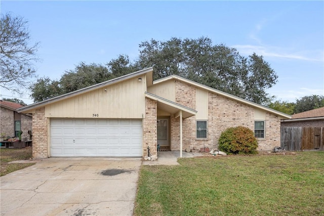 view of front facade featuring a front yard and a garage