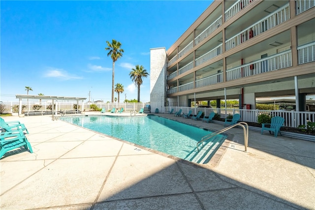 view of swimming pool with a patio area