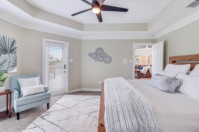 bedroom with ceiling fan, light carpet, a raised ceiling, and ornamental molding