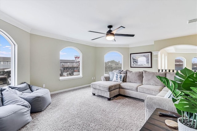 living room with ceiling fan, carpet, and a healthy amount of sunlight