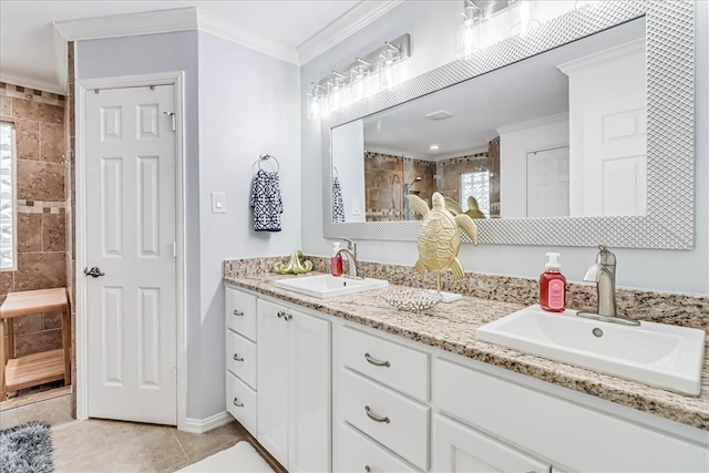 bathroom featuring tiled shower, vanity, tile patterned flooring, and ornamental molding