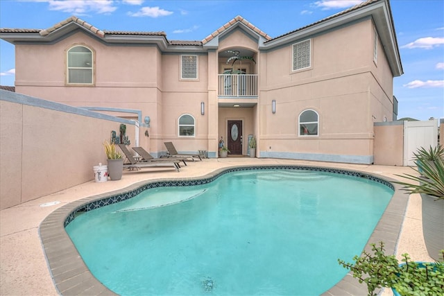 view of swimming pool with a patio