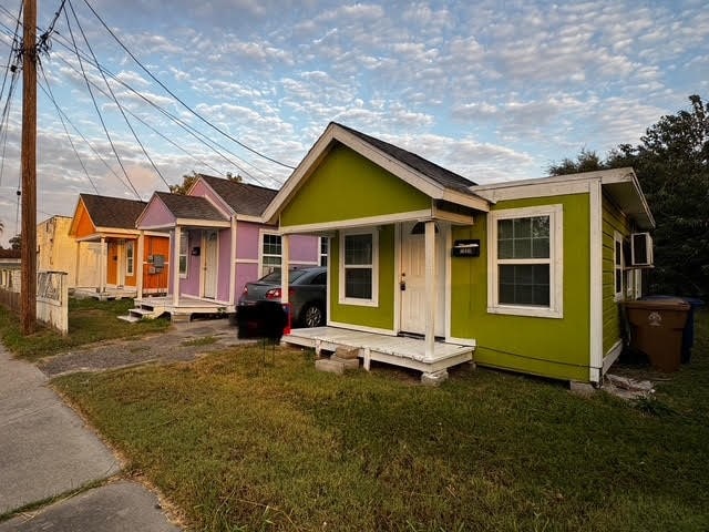 bungalow with a front yard