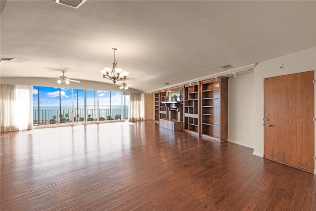 interior space featuring a water view, wood-type flooring, and ceiling fan with notable chandelier