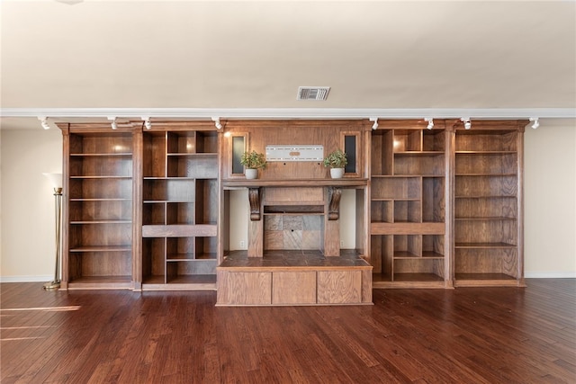 unfurnished living room featuring dark hardwood / wood-style floors