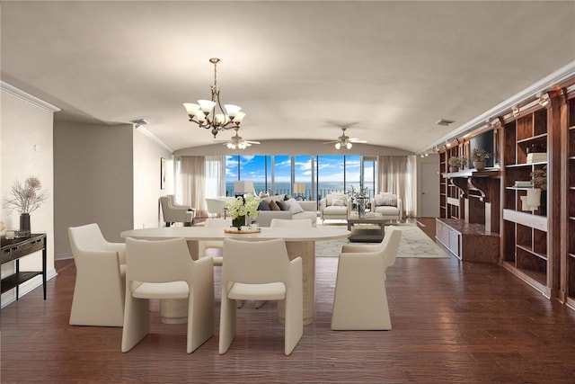 dining area featuring vaulted ceiling, dark wood-type flooring, and ceiling fan with notable chandelier