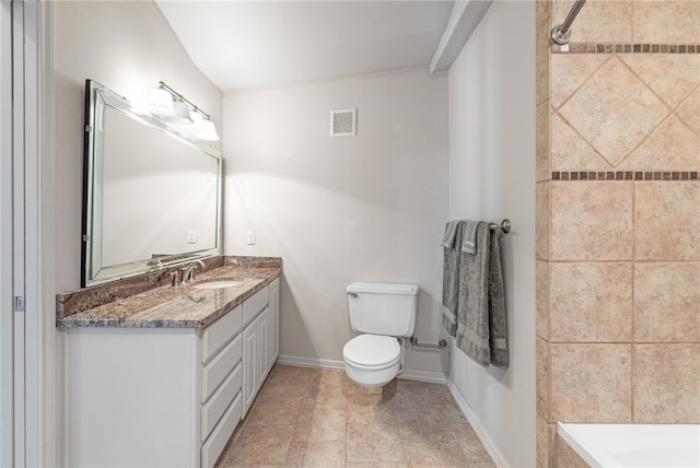 bathroom with vanity, a shower, tile patterned floors, and toilet