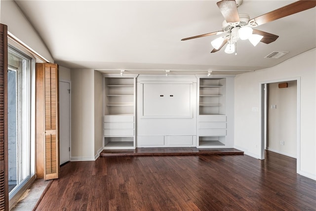 unfurnished bedroom featuring ceiling fan, dark hardwood / wood-style floors, and rail lighting