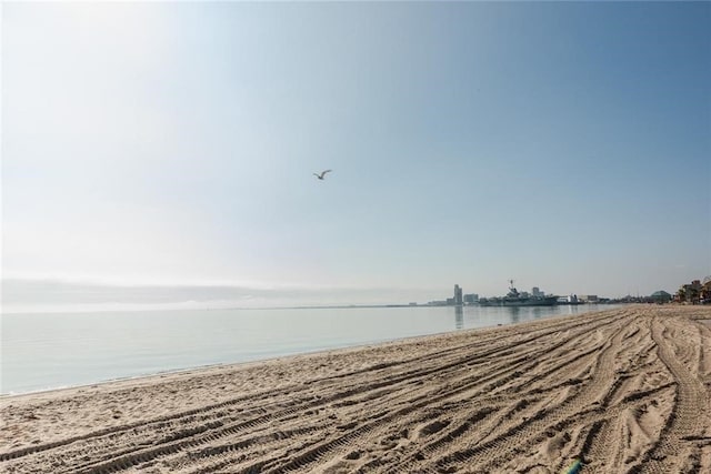 view of water feature with a beach view