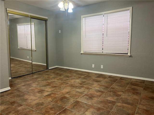 1705 Sherman St, Corpus Christi, TX 78416 - unfurnished bedroom with a closet and ceiling fan
