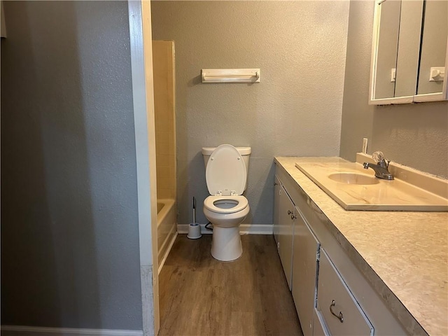 1705 Sherman St, Corpus Christi, TX 78416 - bathroom with vanity, wood finished floors, and a textured wall