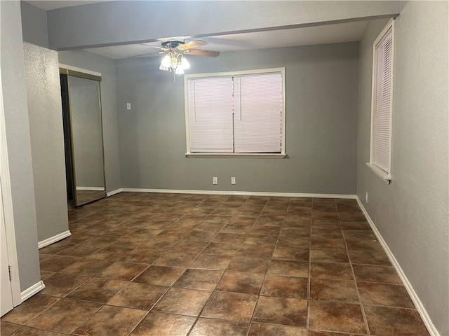 1705 Sherman St, Corpus Christi, TX 78416 - empty room with a ceiling fan and baseboards