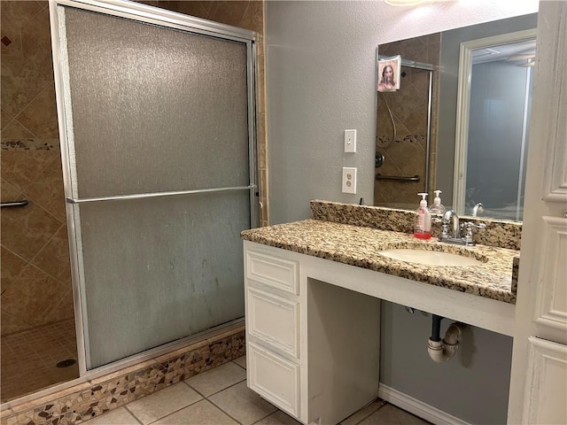 1705 Sherman St, Corpus Christi, TX 78416 - bathroom with a stall shower, vanity, and tile patterned flooring