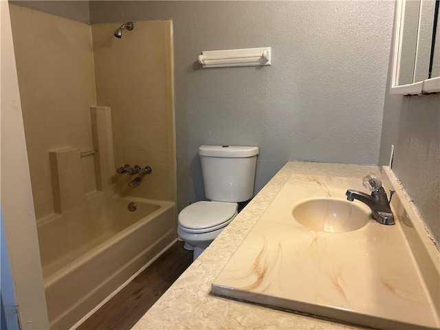 1705 Sherman St, Corpus Christi, TX 78416 - bathroom featuring wood finished floors, vanity, and bathtub / shower combination
