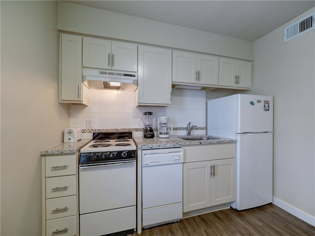 kitchen featuring white cabinetry, white appliances, backsplash, and dark hardwood / wood-style floors