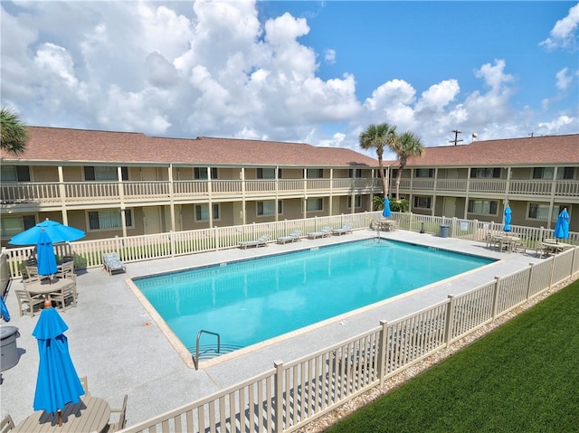 view of swimming pool featuring a patio