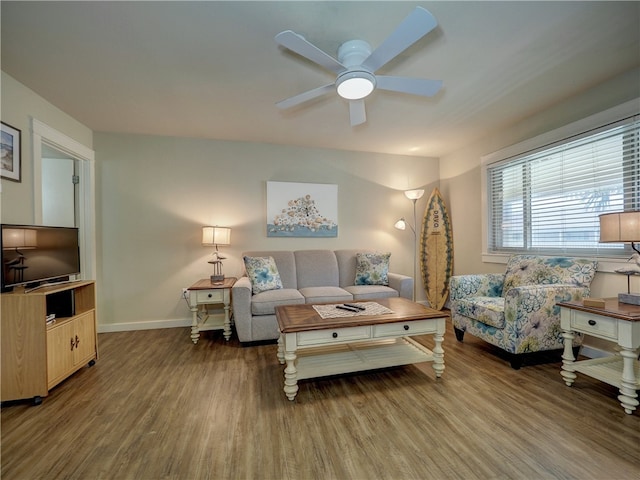 living room with hardwood / wood-style flooring and ceiling fan