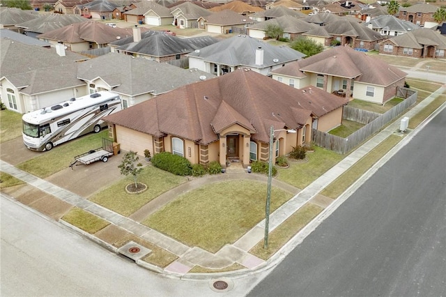 birds eye view of property with a residential view