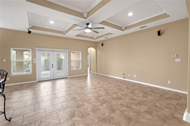 unfurnished room featuring french doors, coffered ceiling, crown molding, ceiling fan, and beam ceiling