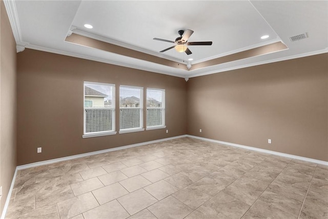 unfurnished room featuring crown molding, ceiling fan, and a tray ceiling