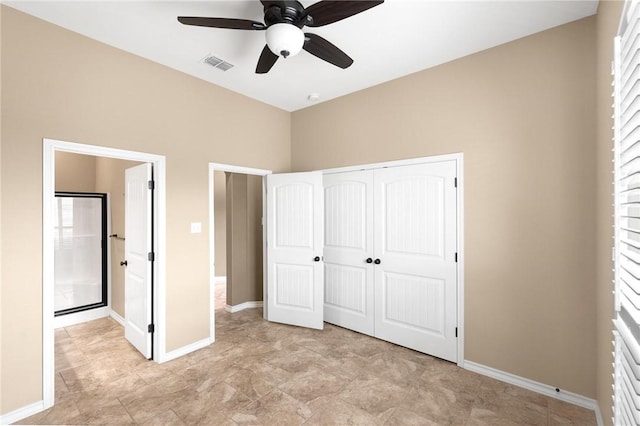 unfurnished bedroom featuring a closet, visible vents, ceiling fan, and baseboards