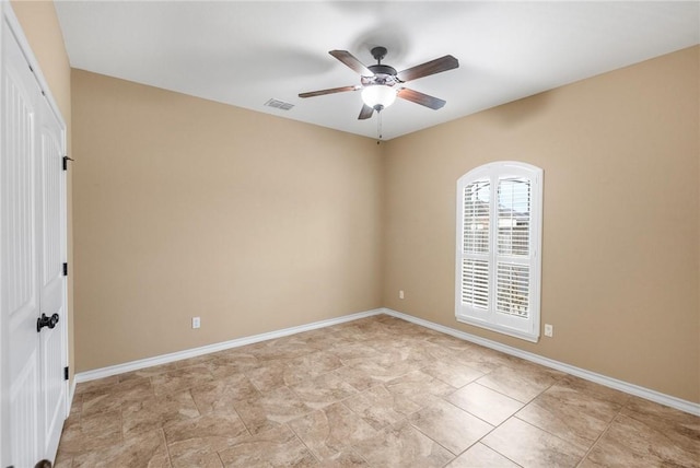 empty room featuring ceiling fan