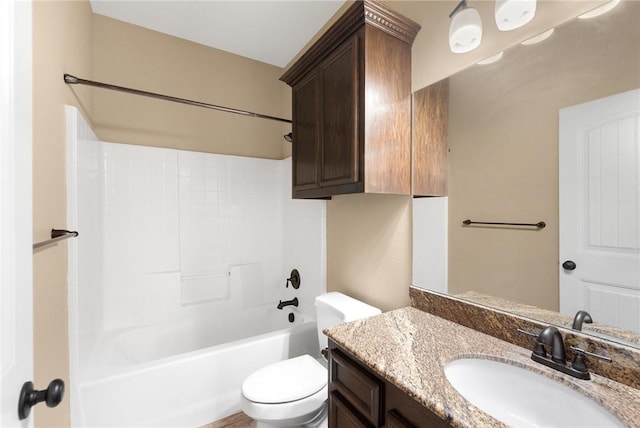 full bath featuring toilet, vanity, and bathtub / shower combination