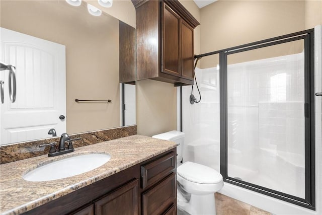 bathroom with vanity, an enclosed shower, tile patterned floors, and toilet