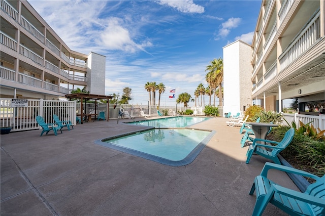 view of swimming pool with a patio area