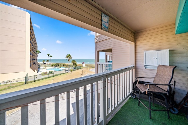 balcony featuring a water view