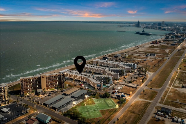 aerial view at dusk with a water view