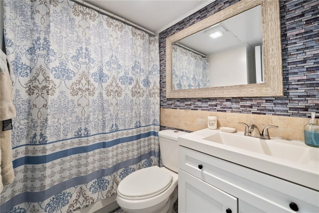 bathroom with tile walls, decorative backsplash, vanity, and toilet