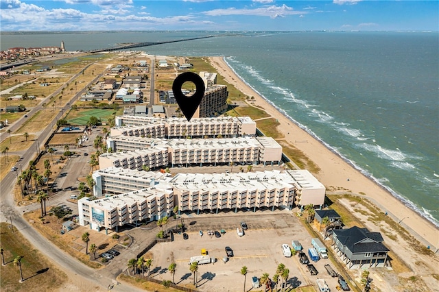 drone / aerial view with a beach view and a water view