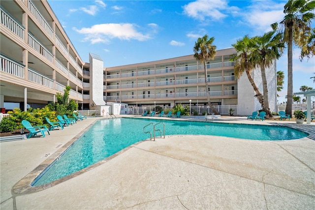 view of swimming pool with a patio