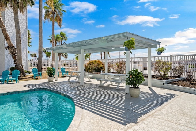 view of swimming pool with a pergola and a patio area