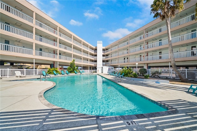 view of swimming pool featuring a patio area