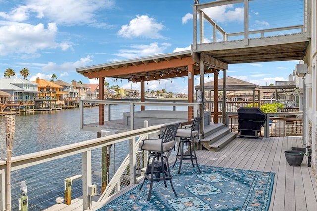 dock area with a deck with water view